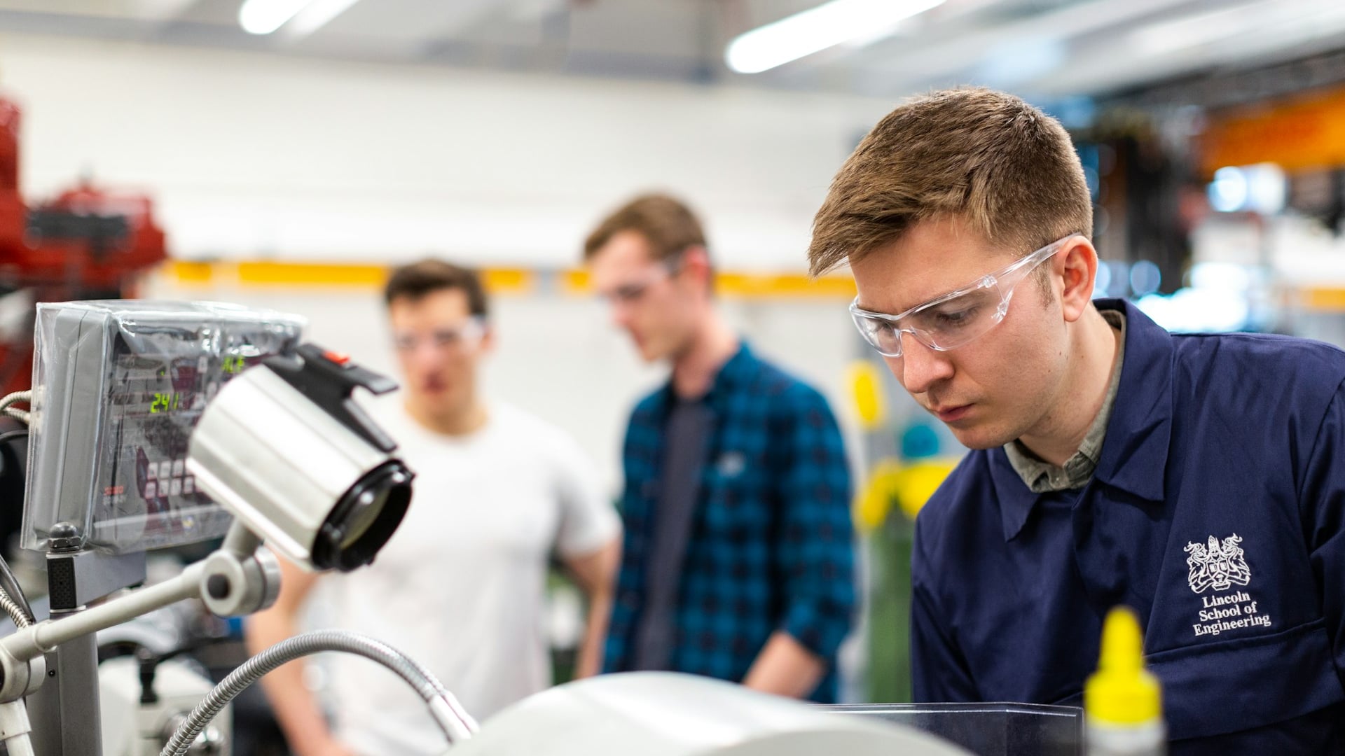 Qualified trades technician precision-machining technical components in a modern workshop for Trades Recognition Australia assessment